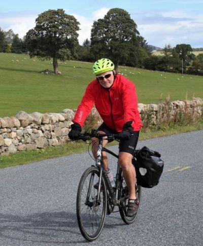 David Mercer Cycling on the  tour with redspokes